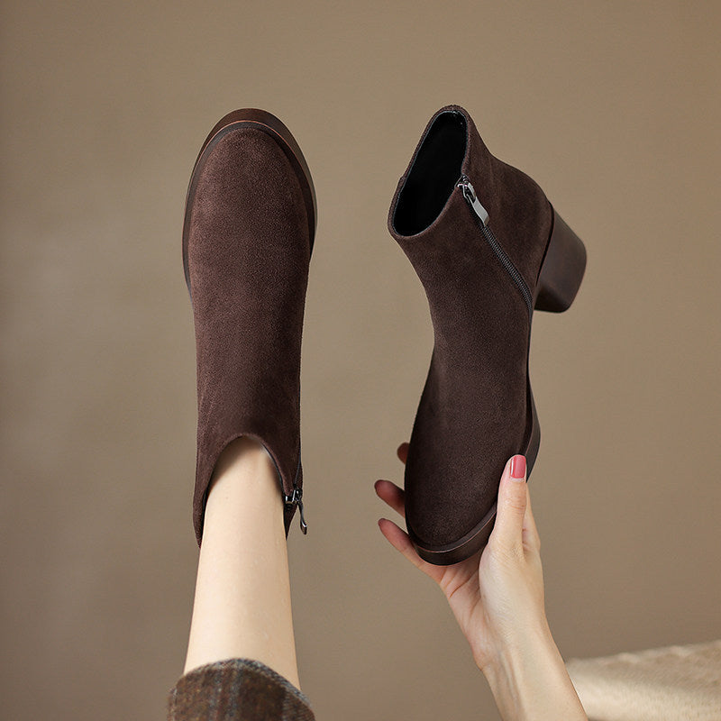 Brown suede finish ankle boots seen from above showing the inside side zipper and block heel