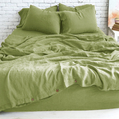 Cotton and linen blend bedding with a relaxed washed texture, shown in a modern bedroom