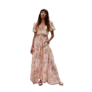 Side profile of the floor-length evening dress showing the high leg slit
