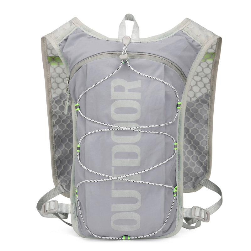 Gray hydration backpack front with reflective OUTDOOR print and crossed bungee cords