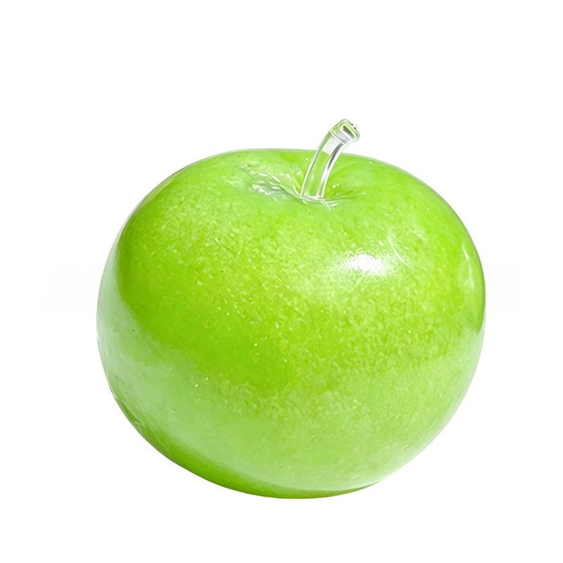 Frosted translucent green apple squishy with clear moulded stem, studio shot on white
