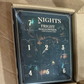 Real photo of the 7 night Halloween countdown box with seven numbered doors inside its shipping carton