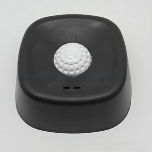 Dog slow feeder lick bowl shown from the front with its ridged tray and center ball