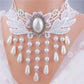 Lace choker necklace with an alloy filigree centre and small dangling beads