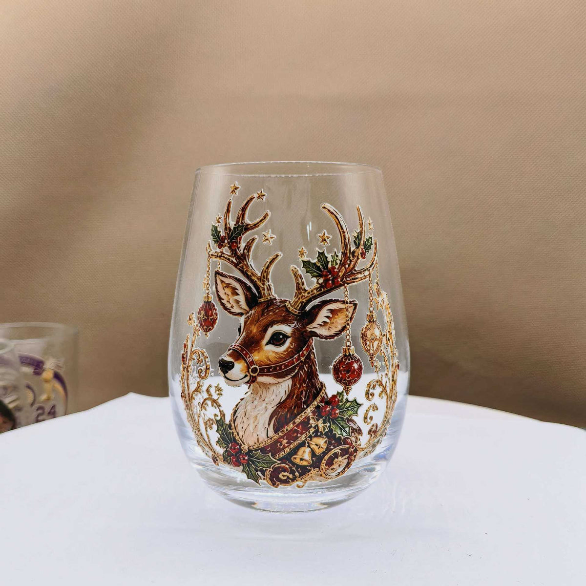Clear borosilicate Christmas glass cup with a raised painted flat reindeer holiday motif