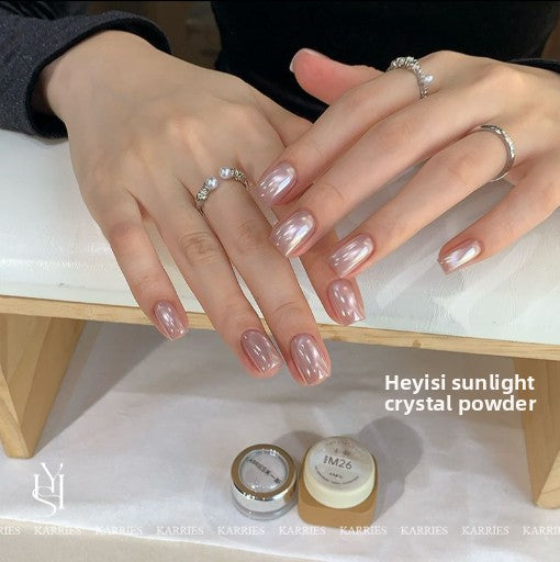 Close view of glossy mirror finish nails made with crystal chrome nail powder