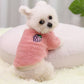 Small white dog in a pink plush pullover with an embroidered grape patch, a pink version not in the options