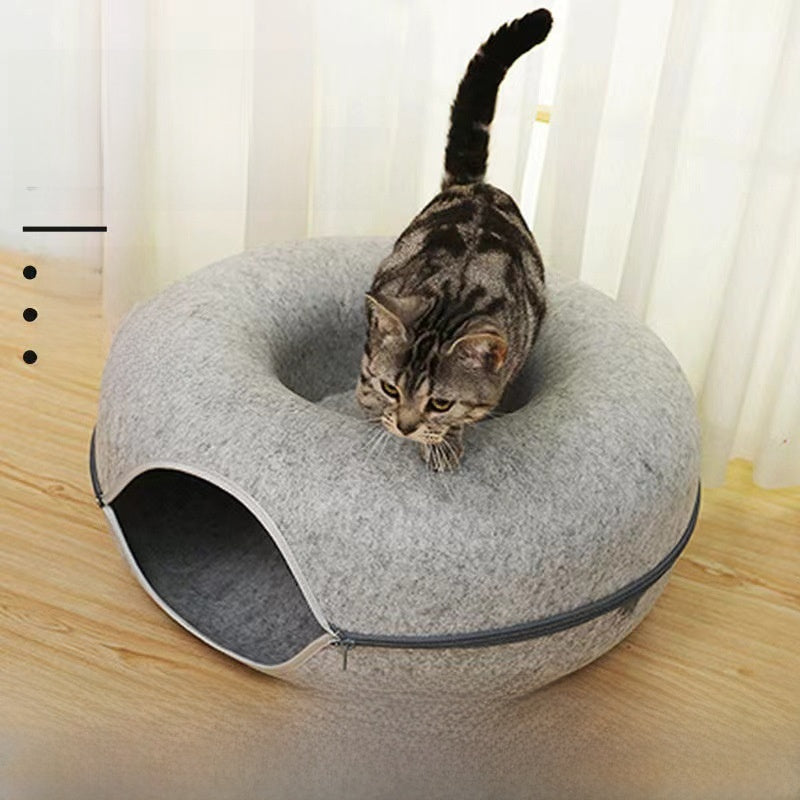 Beige felt cat tunnel bed with the side zipper open to show the round tunnel through the ring