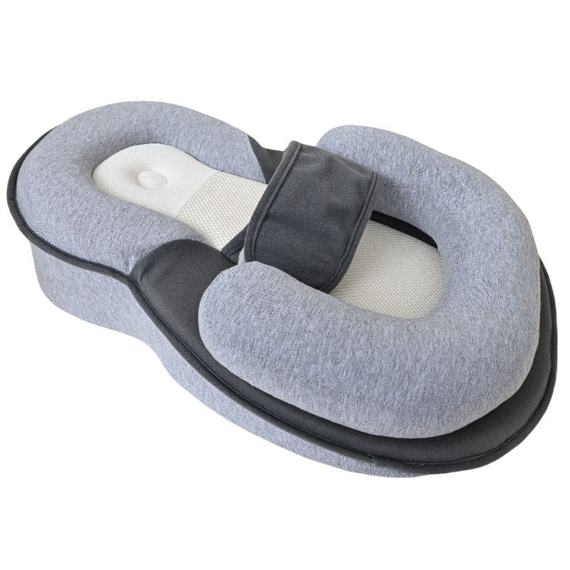 Newborn resting on the anti-reflux lounger slope in a lifestyle in-use scene