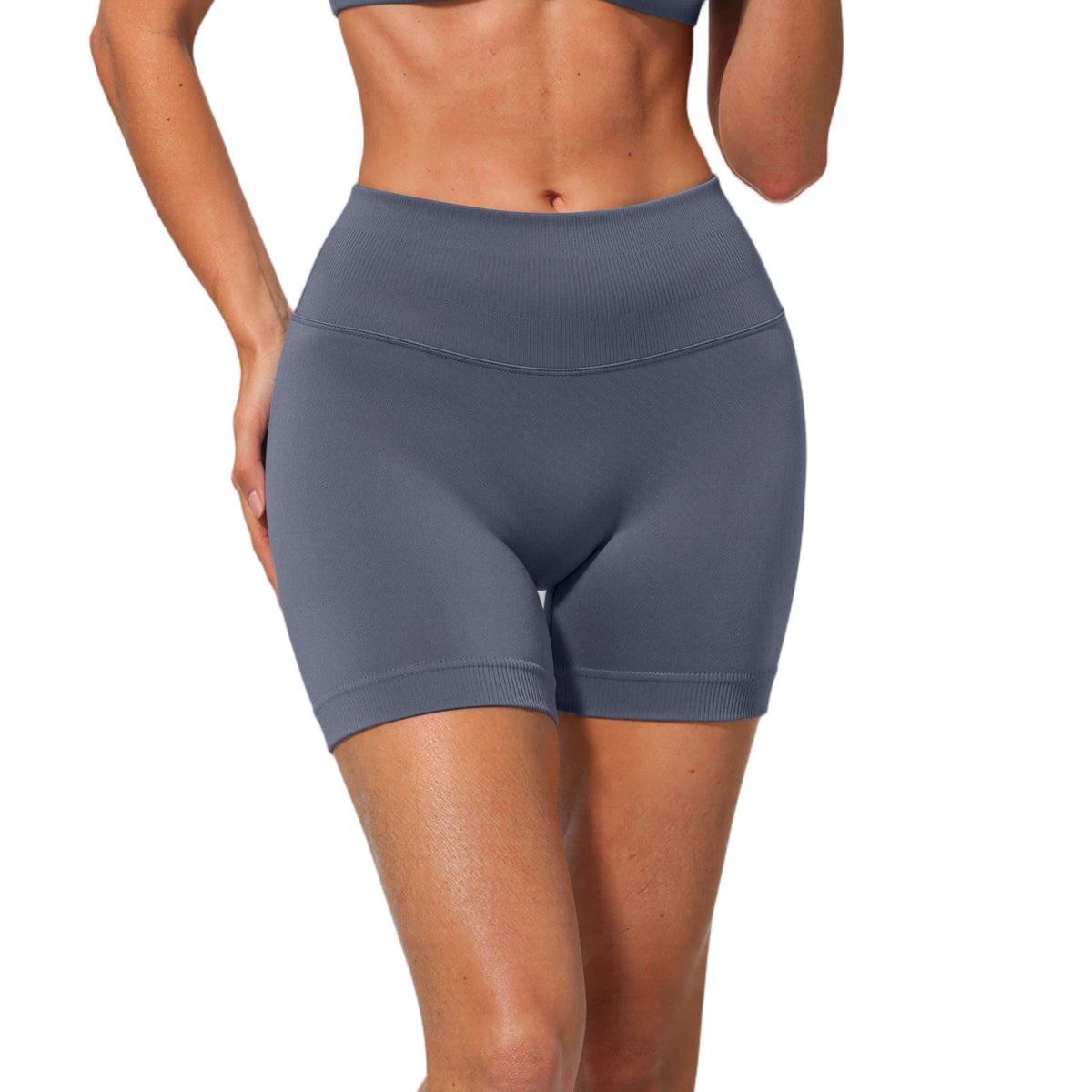 Front view of dark gray blue high waisted seamless shorts with a ribbed waistband on a white background