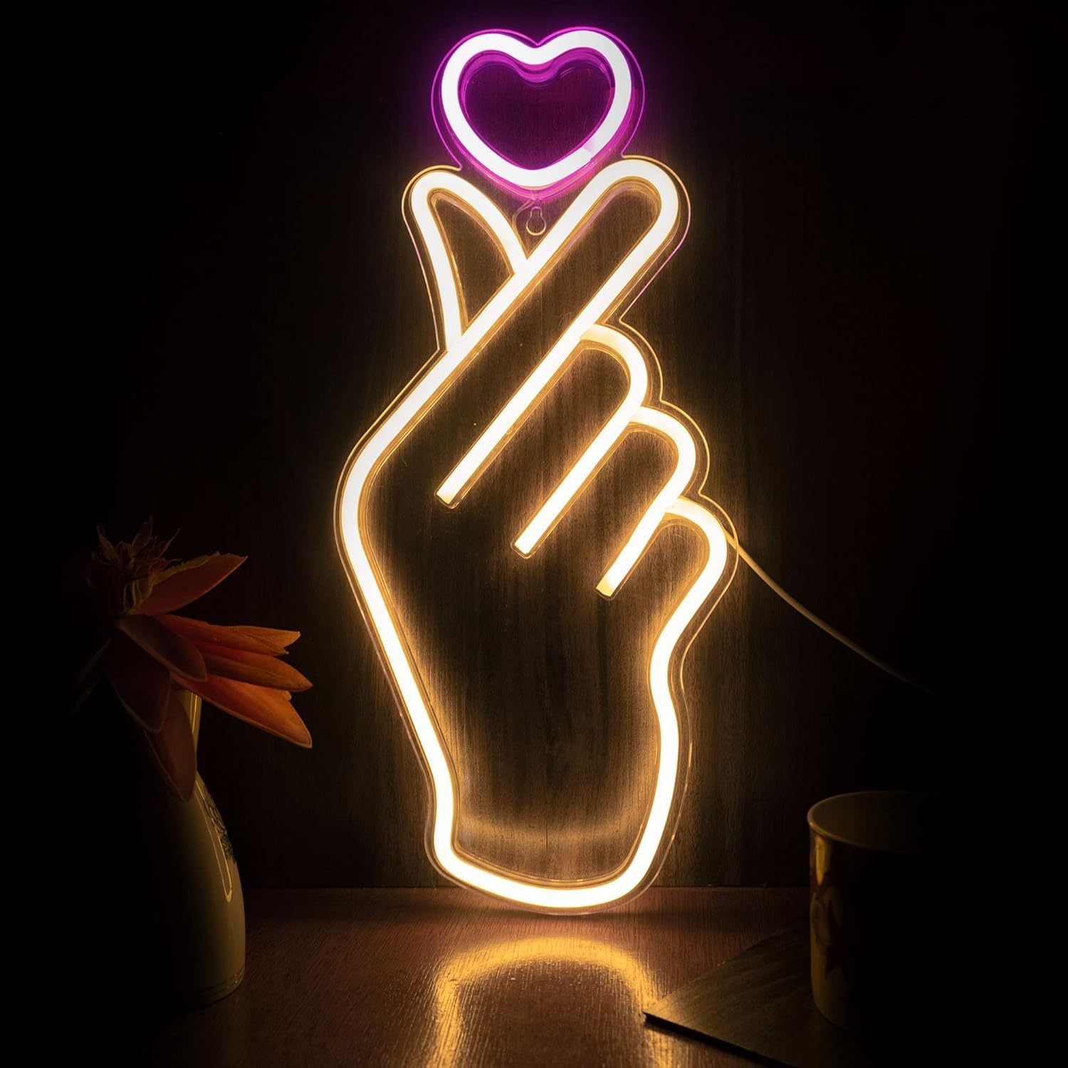 LED neon wall light sign, glowing against a dark wall