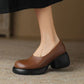 Brown PU slip-on platform pump with chunky rounded heel, size 35 option, worn with a black skirt on carpet