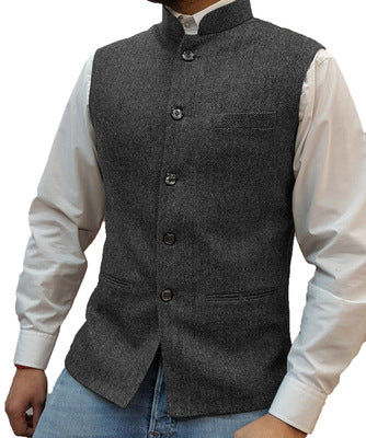 Gray herringbone stand collar vest over a white shirt, size S