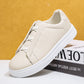 Beige pebbled vegan leather slip-on low-top sneakers with white sole and cream elastic straps, size 41 option photo