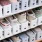 Closet shelves full of shoes stacked two levels high on white shoe slot organizers