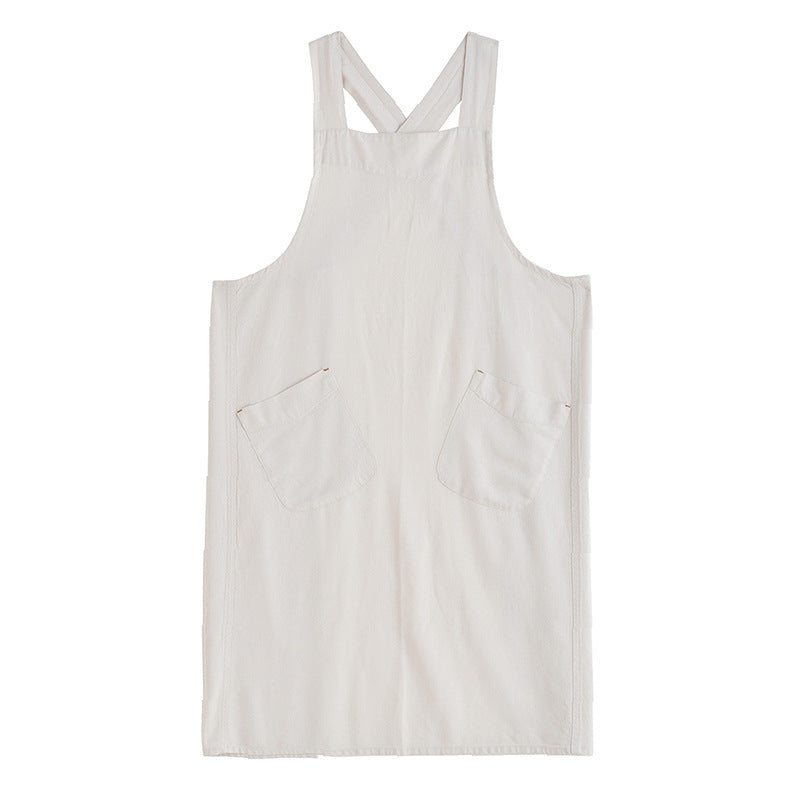 Apron hung from a wooden peg by the back door at end of service