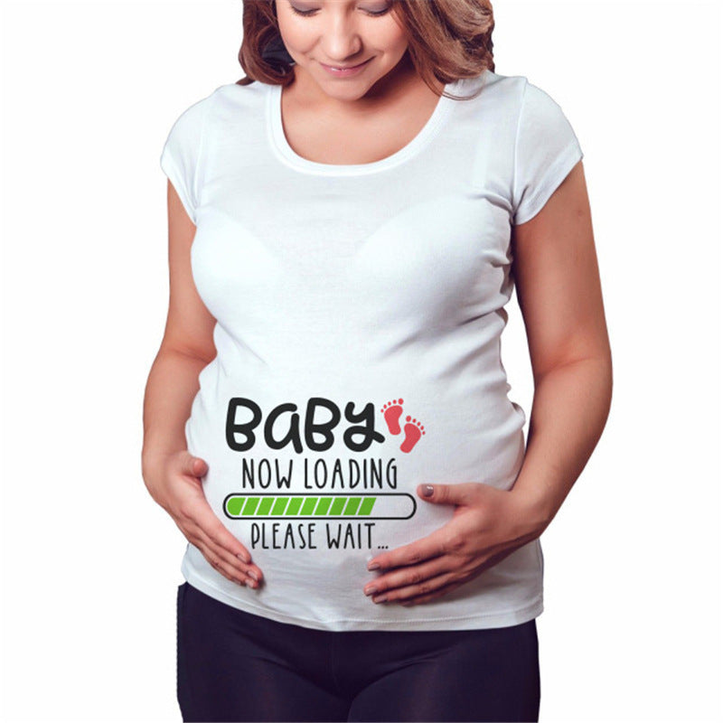White maternity short sleeve tee with a Baby Now Loading footprints print, round neck and side ruching, on a pregnant model