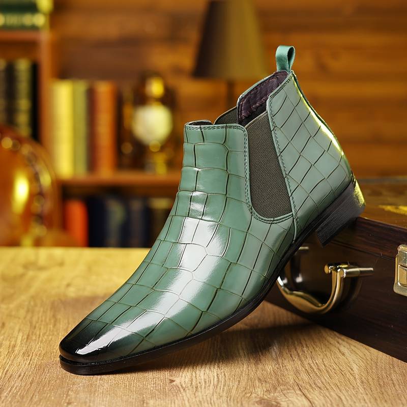 Plaid green variant, size 42: green plaid grid ankle boot with an elastic side panel on a brass-fitted wooden case