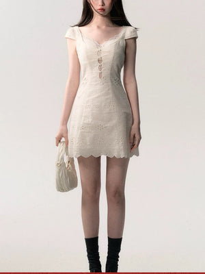 Cream white lace patchwork summer dress, front view showing the lace panels and relaxed cut