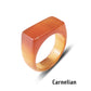 Carnelian stone ring with a rectangular face on a white background