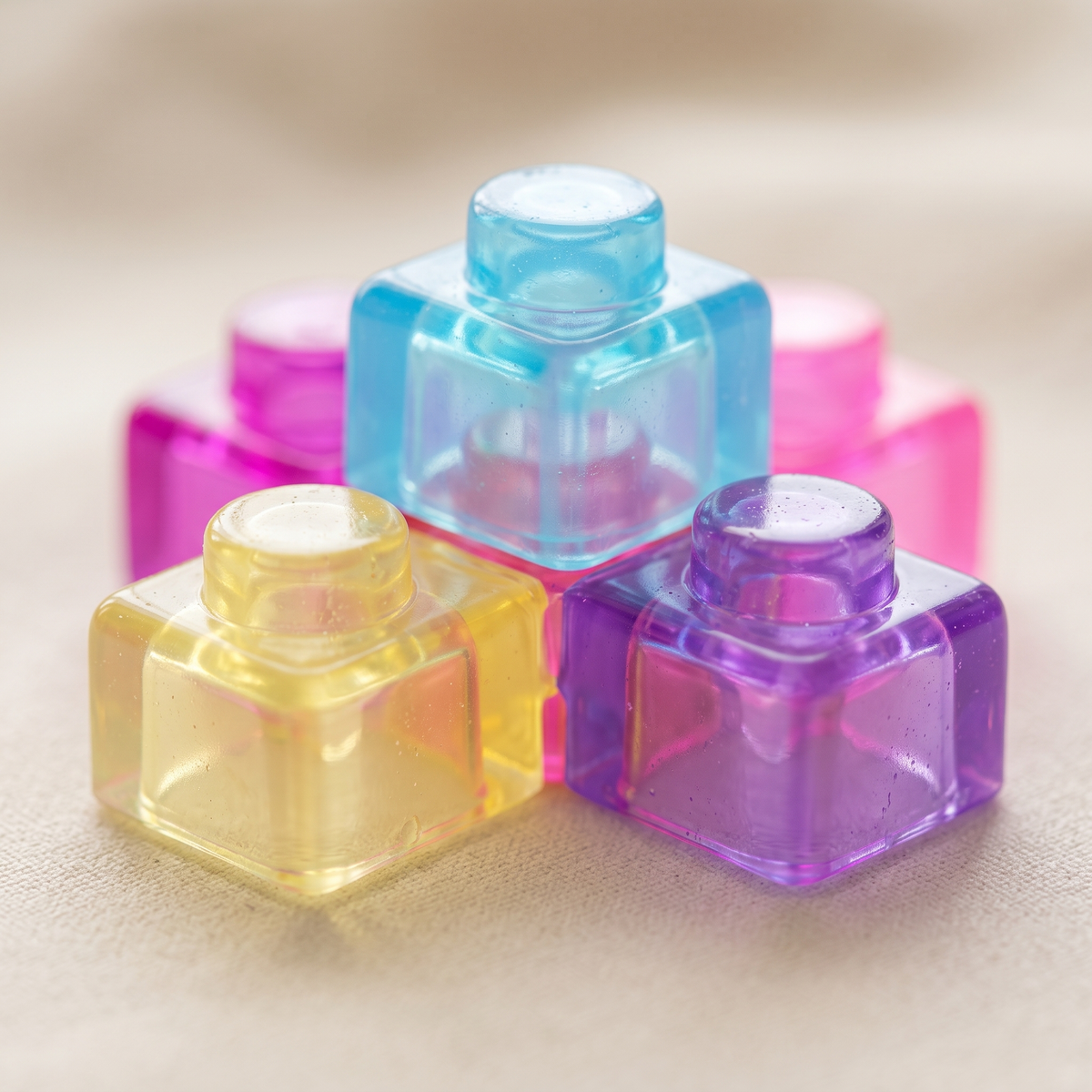 Macro of translucent jewel tone squishy building blocks