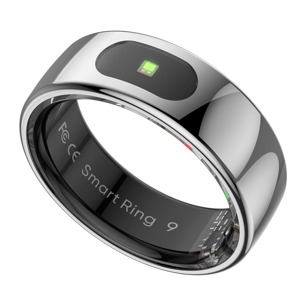 Gold smart ring next to the closed charging case