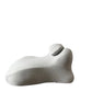 Light gray back cushion in profile on white, small neck roll strapped into the upper valley