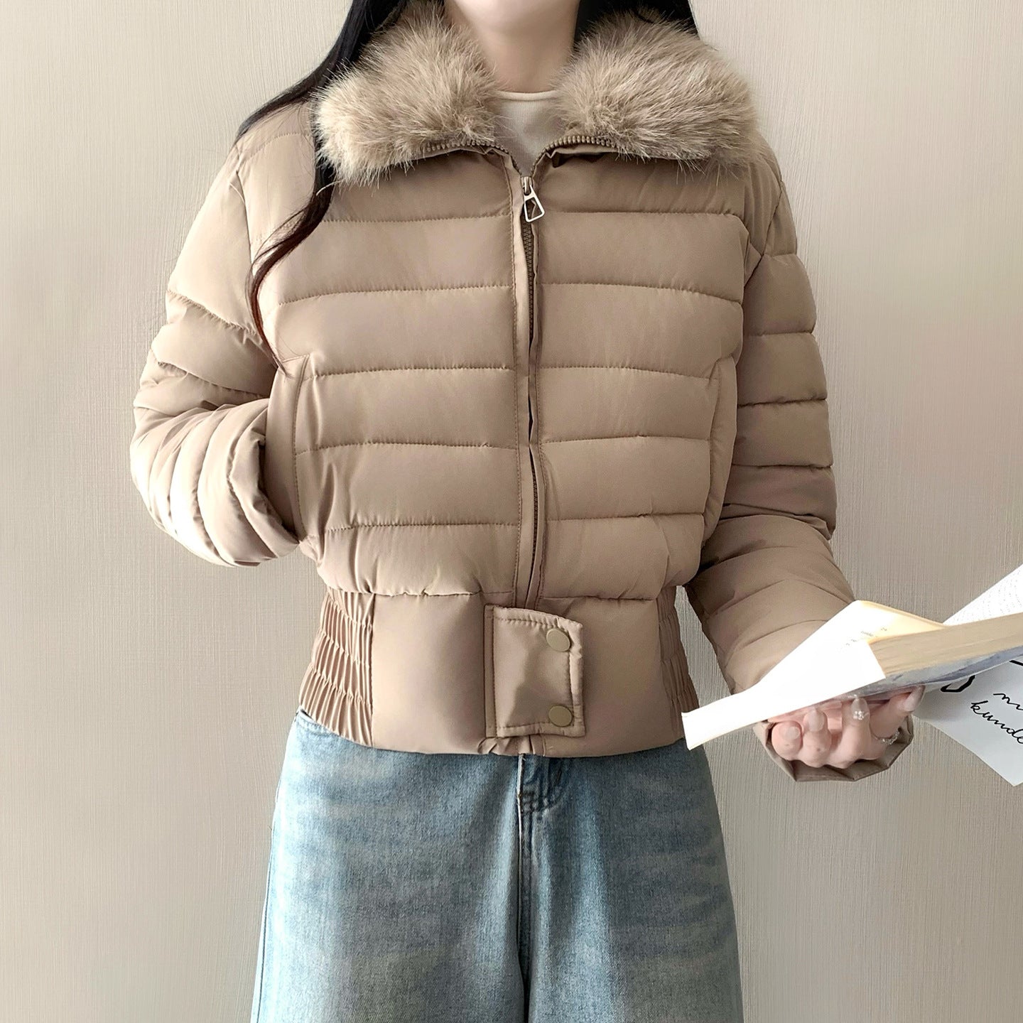 Full length front view of the padded puffer jacket with the fur collar standing at the neck