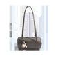 Gray cylinder shoulder bag with two long straps and a baseball charm on a white background, option Gray
