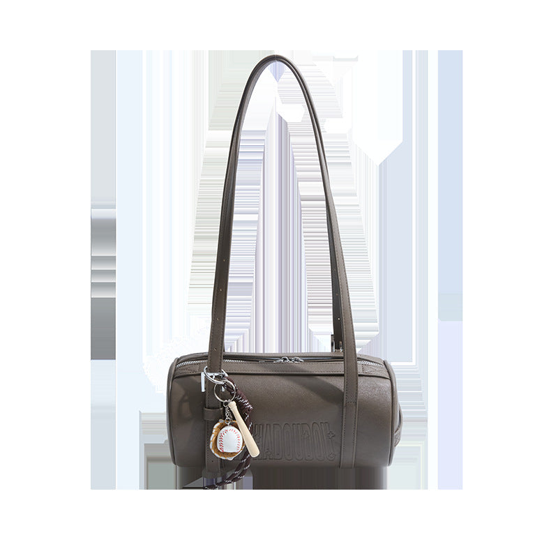 Gray cylinder shoulder bag with two long straps and a baseball charm on a white background, option Gray