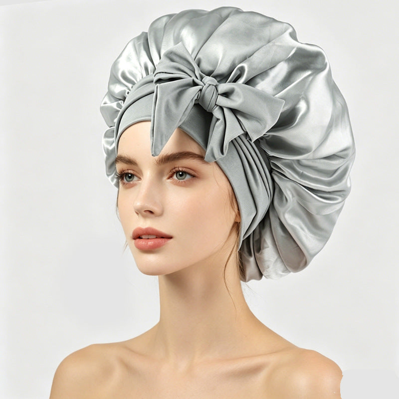 Satin sleeping bonnet with a smooth shiny face and a soft stretch band at the edge