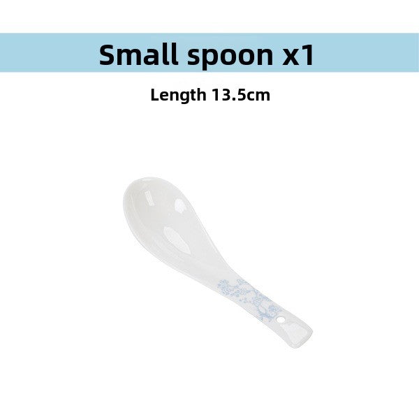 Small porcelain spoon with a blossom accent on the handle