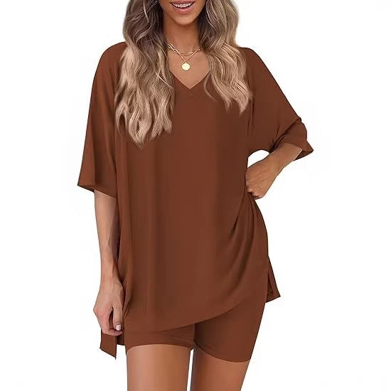 Loungewear set with a loose V neck milk silk top and high waist shorts, shown on a model