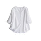 Loose fit linen shirt with a collarless V neck shown flat
