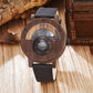 Top down view of the wooden compass watch with dial and strap flat