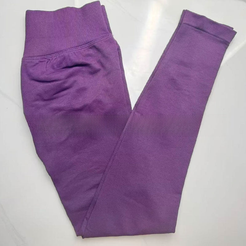 Grape purple seamless leggings with the curved knitted seat panel visible on the flat lay