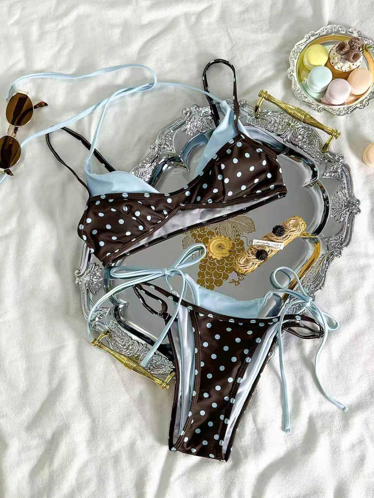 Brown polka dot bikini worn outdoors, adjustable straps on the triangle top and knotted hips