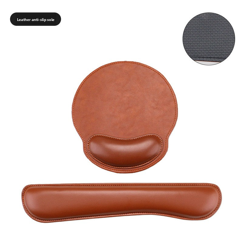 Pink mouse pad and keyboard wrist rest set on a desk