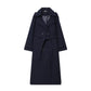 Double breasted belted longline woollen look overcoat, the self tie belt knotted at the front