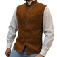 Rust orange herringbone stand collar vest with button front worn over a white shirt