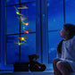 Dragonfly LED figures hanging from a solar lamp head, glowing in several colors at night, black housing option