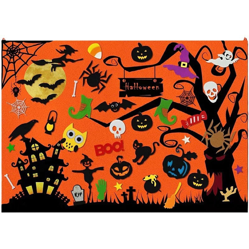 Halloween felt story board with felt bats, pumpkins, spider and haunted house pieces on orange felt