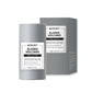 Gray BARUBT Alaska Volcano pore clay stick with its carton behind it on a white background