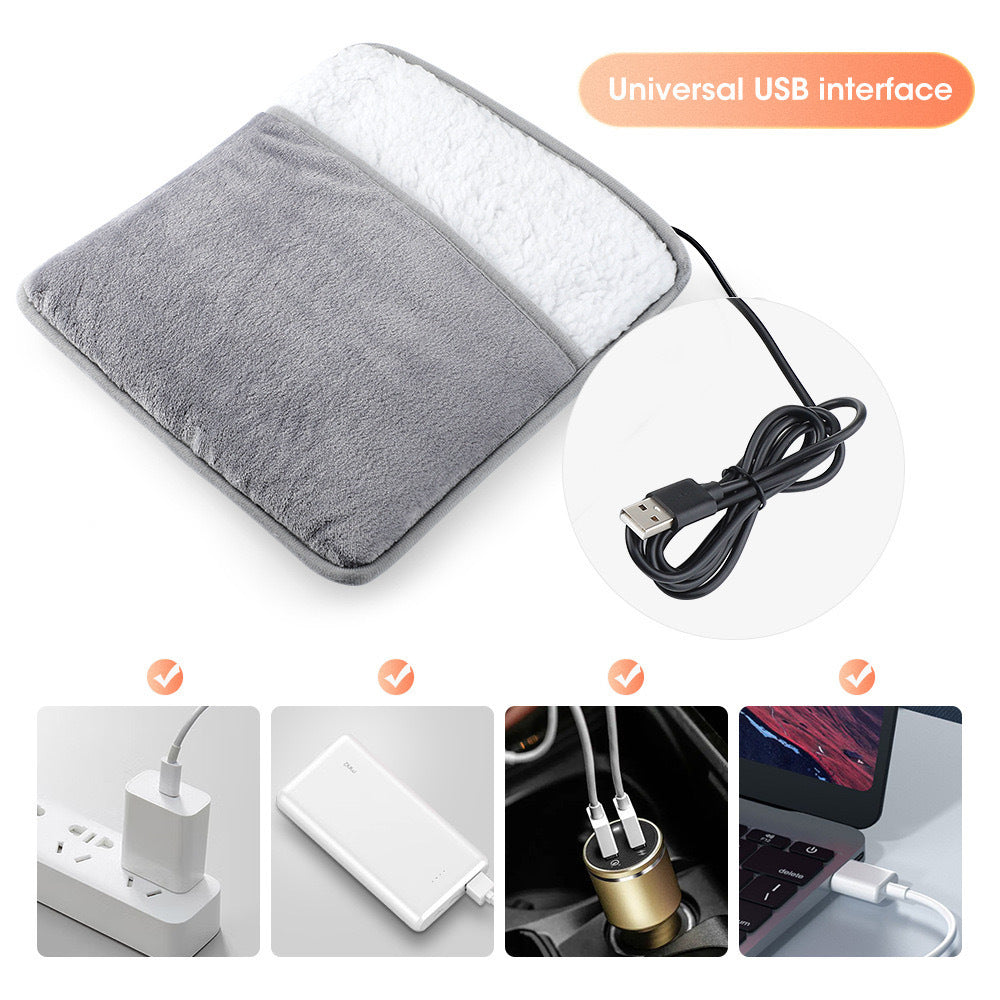 Electric heated foot warmer in white and gray plush velvet shown on the floor