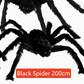 Hairy black Halloween spider prop with red eyes, flocked body and eight posable bendable legs
