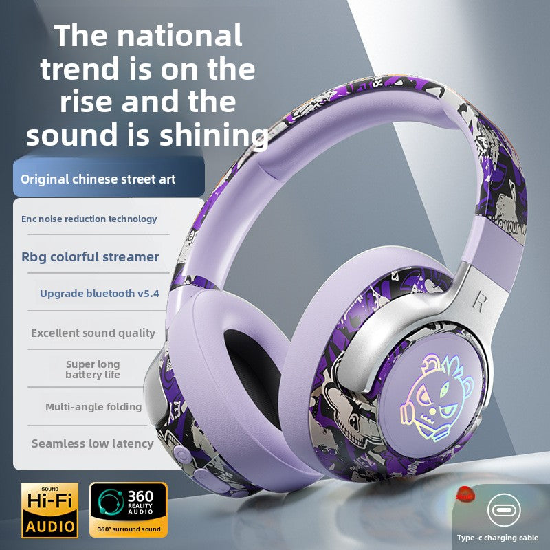 Purple graffiti wireless over-ear gaming headset with a glowing RGB earcup logo