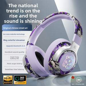 Purple graffiti wireless over-ear gaming headset with a glowing RGB earcup logo