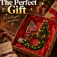 Gift box holding the Christmas tree USB projector light and a Merry Christmas tag on red tissue
