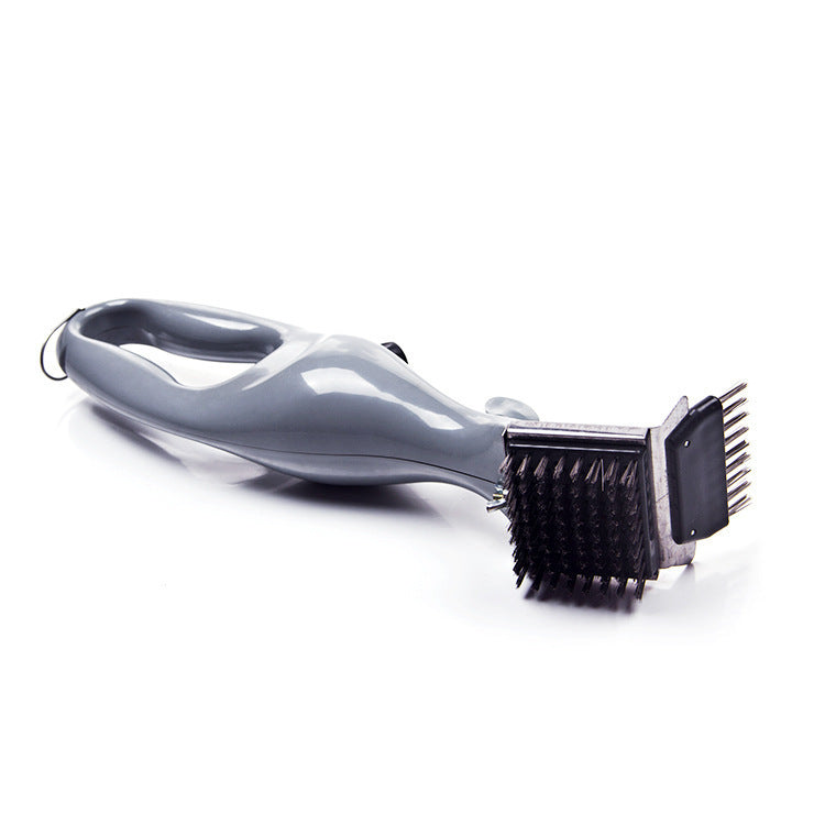 Side angle of the barbecue grill brush with grate comb teeth and steel bristles on the cleaning head