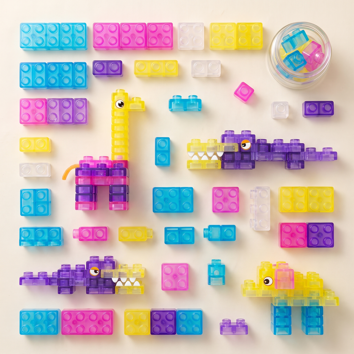 Flatlay of assorted translucent jelly blocks and finished animal builds